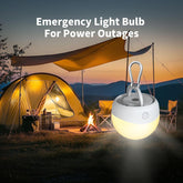 Emergency light bulb for power outages with a camping scene in the background